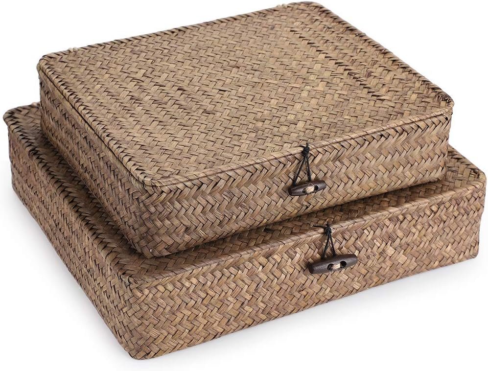 Two stacked rectangular woven baskets with button-and-loop closures.