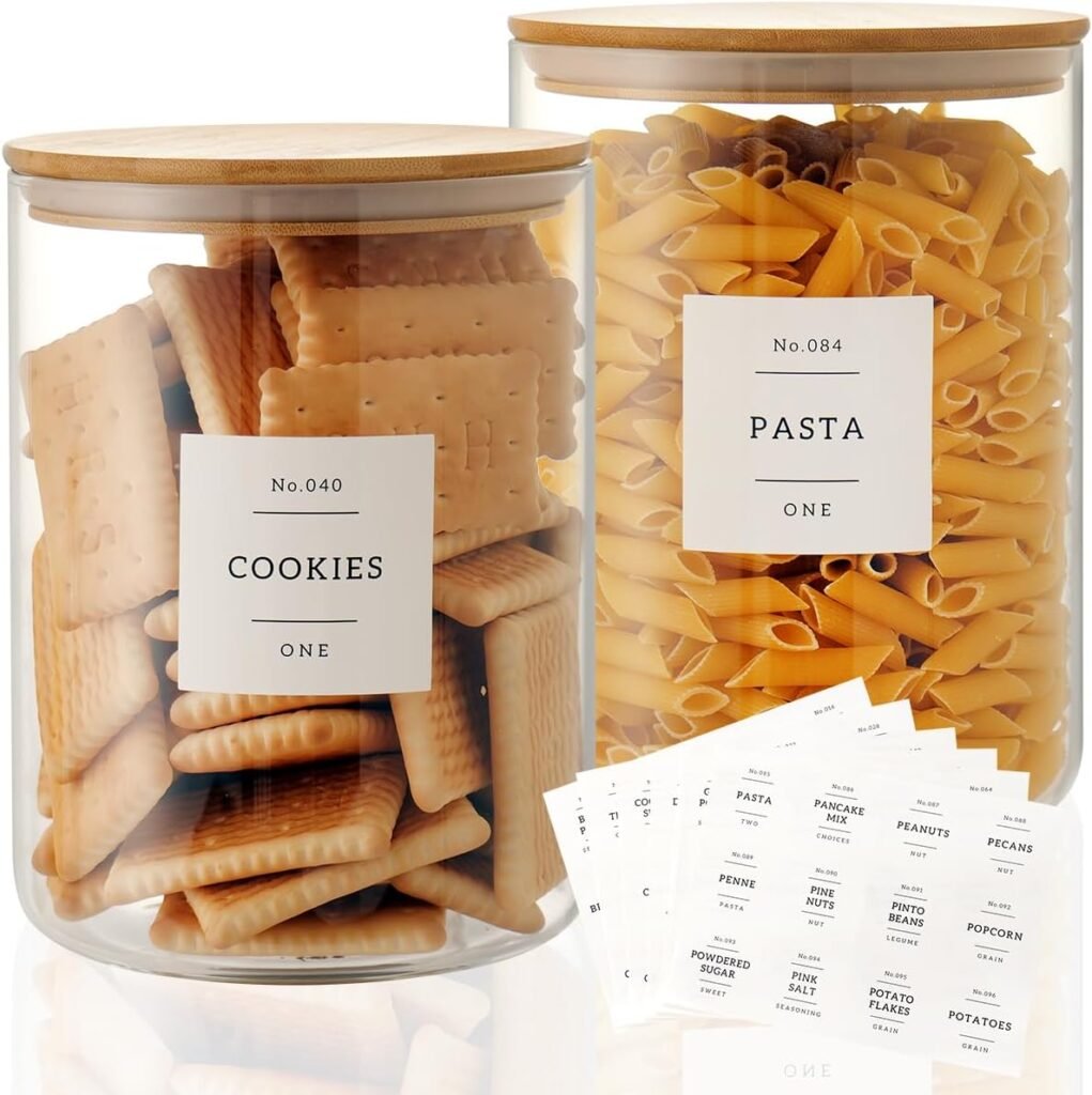 Clear glass storage jars with bamboo lids and minimalist labels, ideal for Japandi pantry organization.