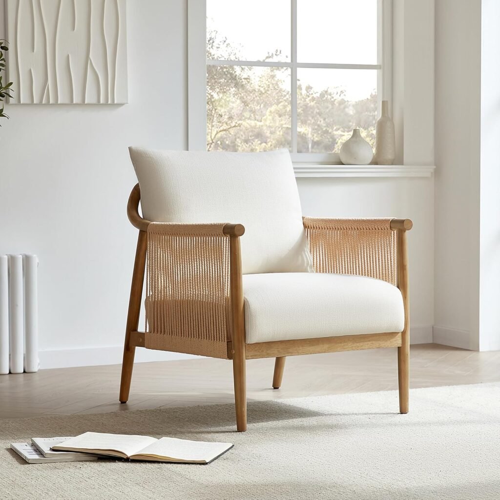 Japandi accent chair with natural wood frame, cream cushions, and rope-wrapped sides styled in a minimal living room.