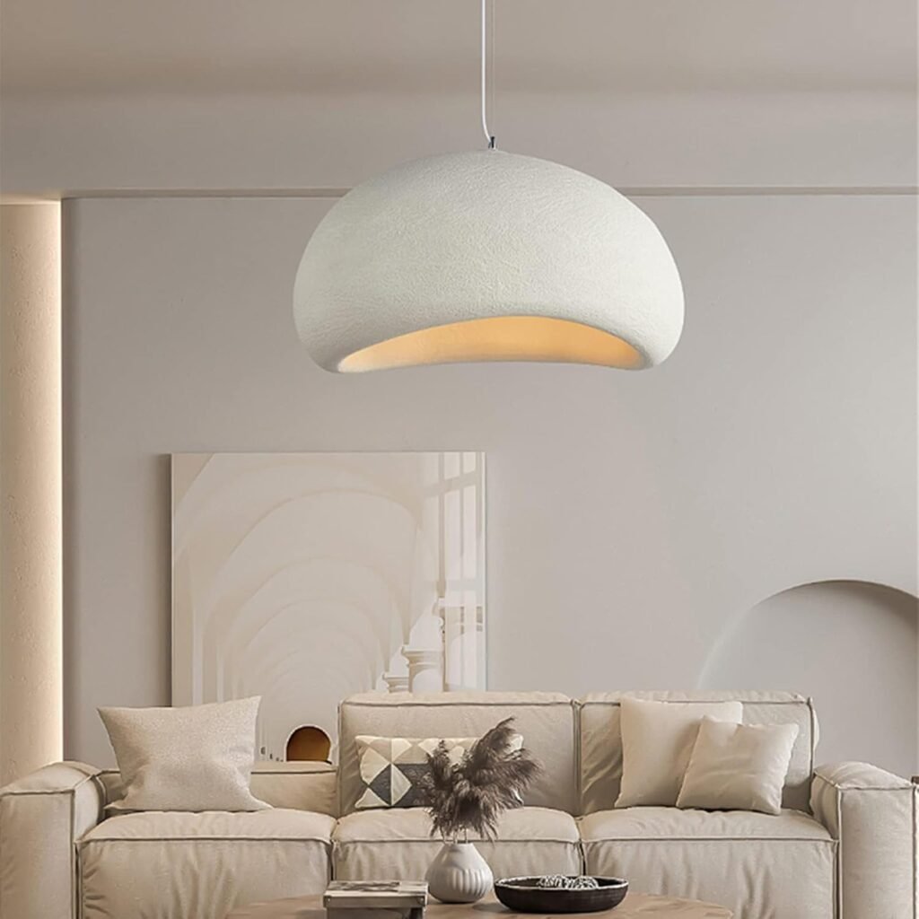 Minimalist dome pendant light above a neutral Japandi living room sofa