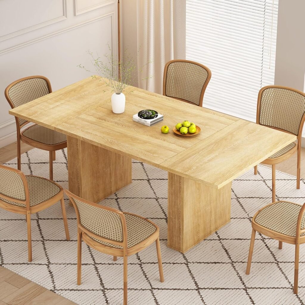 Japandi dining table with ribbed wood block base, paired with cane dining chairs and styled in a neutral dining room with natural light.