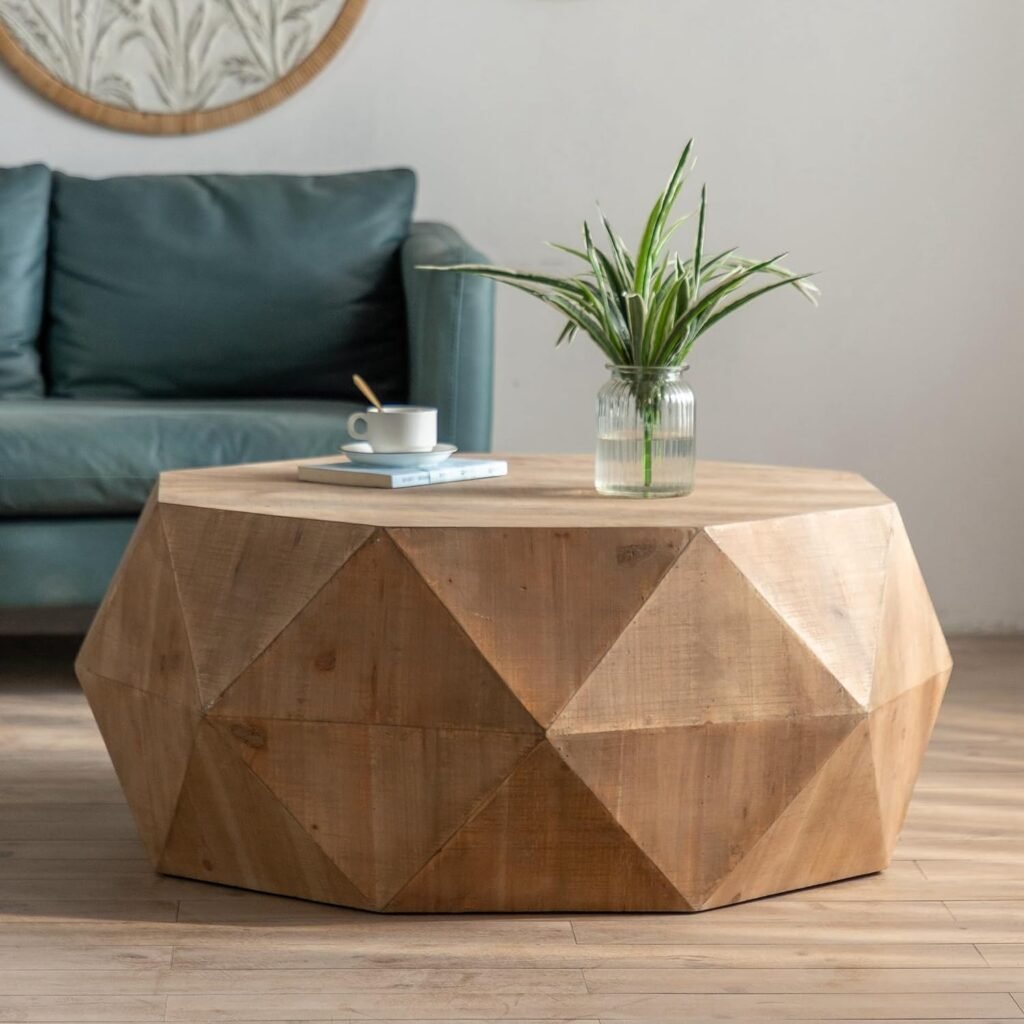 faceted geometric wood coffee table in natural finish styled with plant in coastal modern space