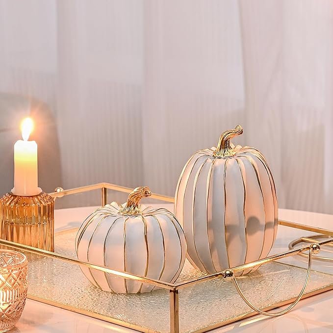 Pair of white pumpkins with gold stems and gold accent lines displayed on a gold tray for elegant fall décor.