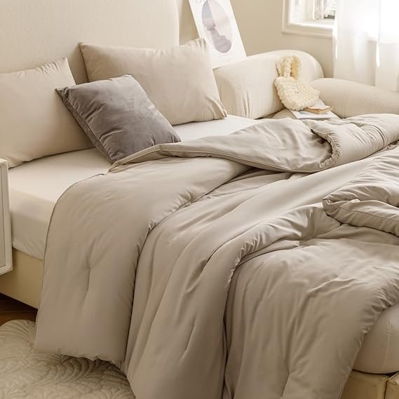 Cozy beige duvet cover and pillow set with soft, neutral tones, creating a minimalist Japandi-style bedroom look.