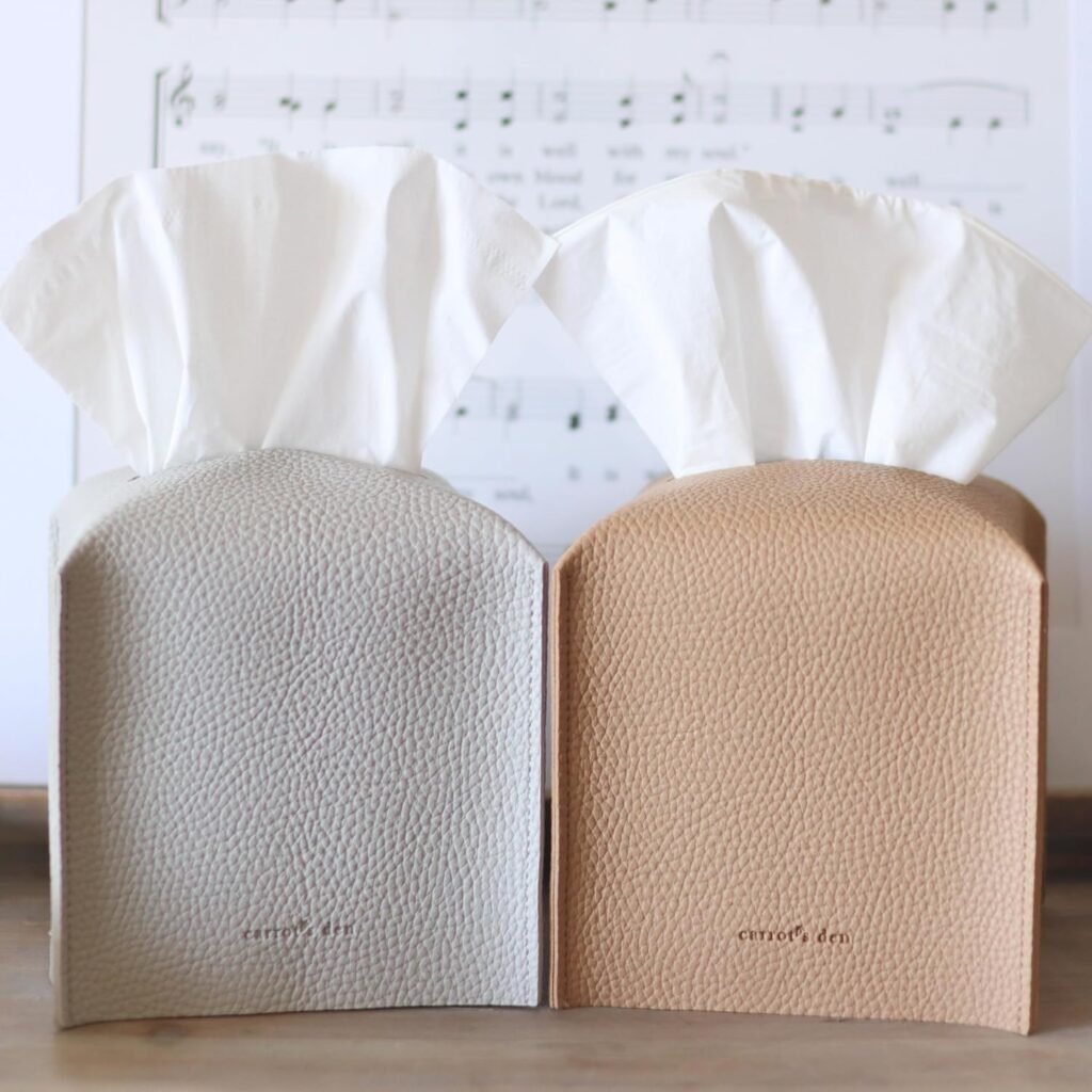 neutral leather tissue box covers in beige and gray styled on wood table for modern decor