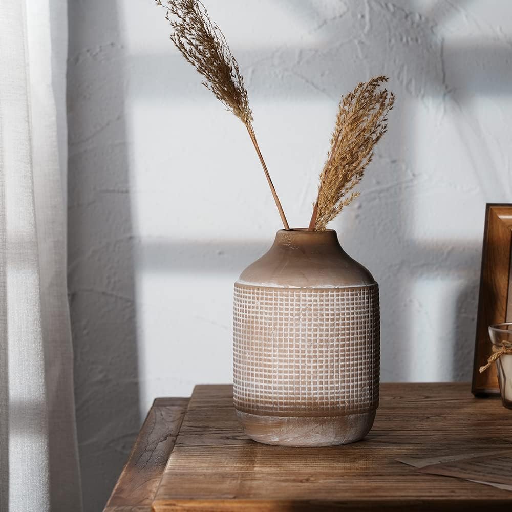 neutral ceramic vase with dried pampas grass styled on rustic wooden table in fall home