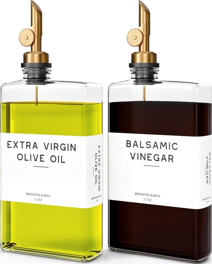 modern glass olive oil and vinegar dispensers with gold spouts styled for an organic modern kitchen