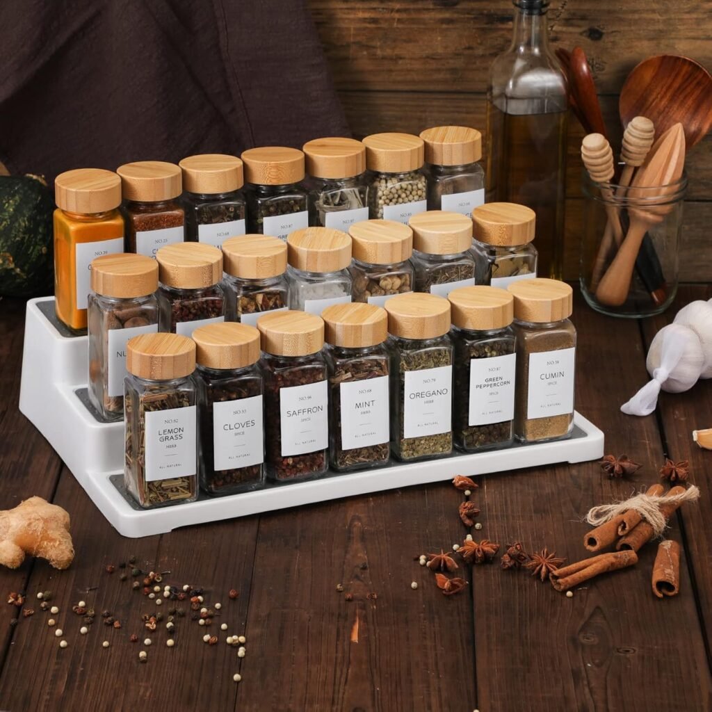 minimalist glass spice jars with bamboo lids and clean labels displayed on spice rack
