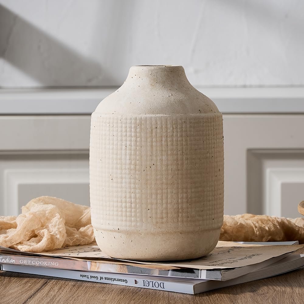 natural ceramic vase with textured finish styled on wood table